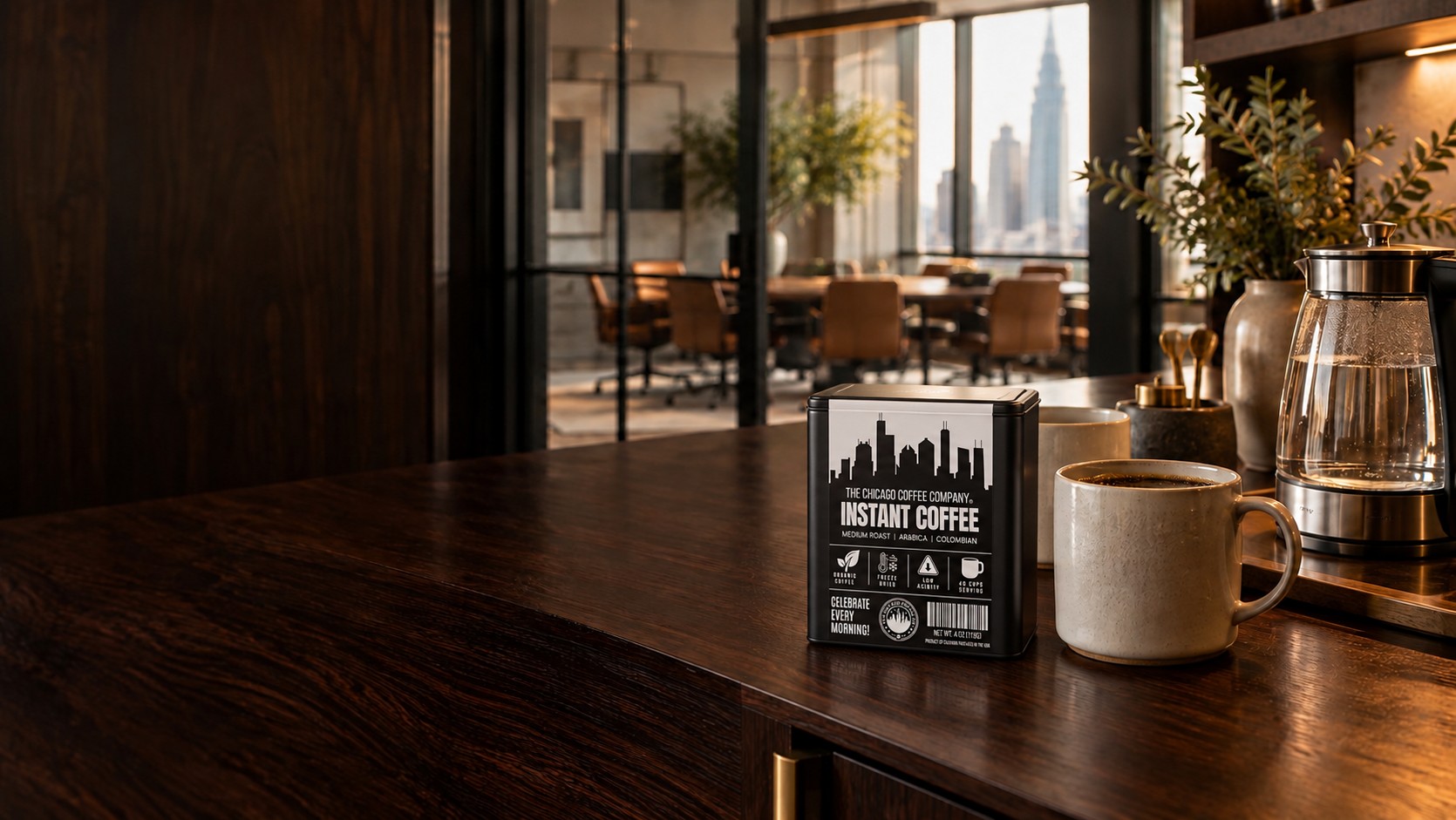 Chicago Coffee Company instant coffee tin beside mugs and a kettle in a warm workplace